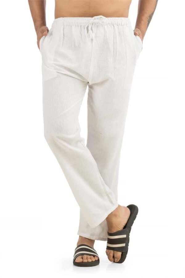 6ft male model wearing Hallucination pure linen cotton blend pajama pant in white – soft, breathable one-size summer loungewear for sleep, travel, yoga, and beach.